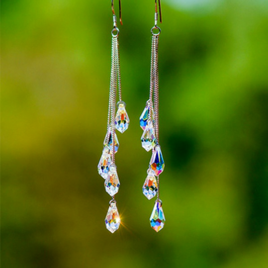 Silver teardrop dangle earrings with blue AB crystals and long chain drops