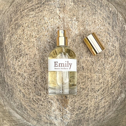 Emily perfume spray bottle with gold cap, clear glass and pale yellow liquid