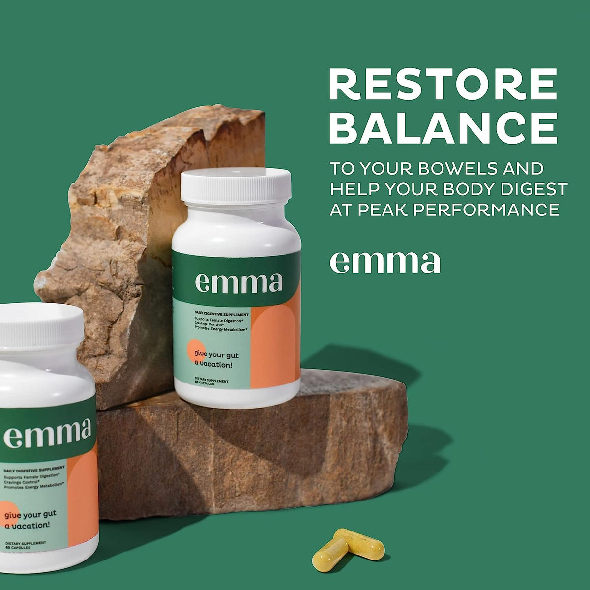 Gut health supplement bottle with white cap and green label on stone block