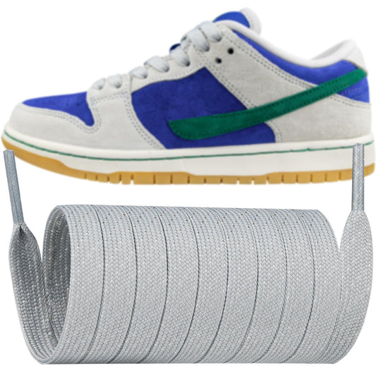 Grey woven shoelaces on a coil reel with aglet tips