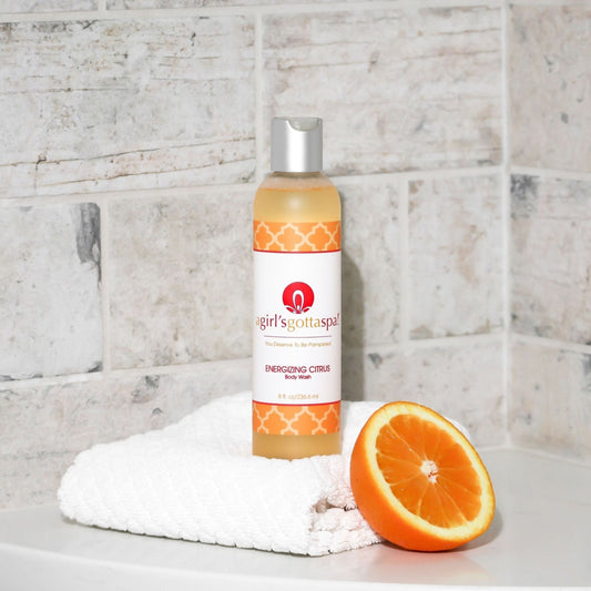 Orange body wash bottle with silver cap, agirl'sgottaspa Energizing Citrus label