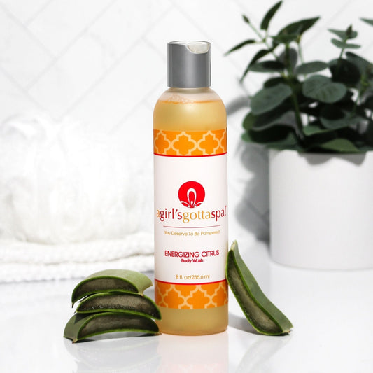 Orange body wash bottle with silver cap, agirl'sgottaspa Energizing Citrus label