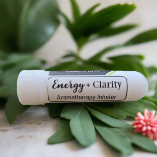 White aromatherapy inhaler stick labeled Energy+Clarity