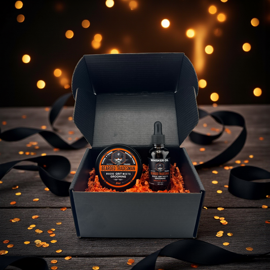 Grooming gift set in open dark box with round balm tin and dropper bottle