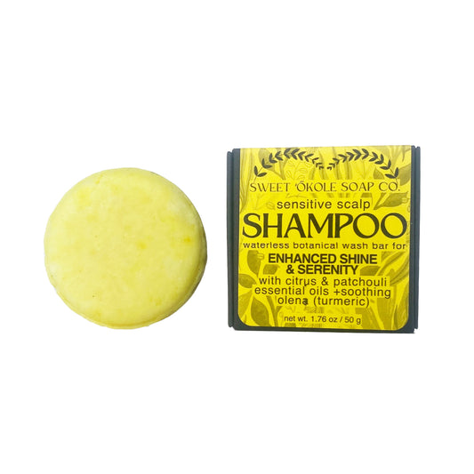 Yellow round essential oil shampoo bar with rectangular wrap package