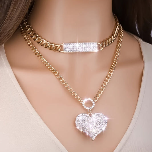 Gold double-chain necklace set with rectangular crystal bar and heart pendants