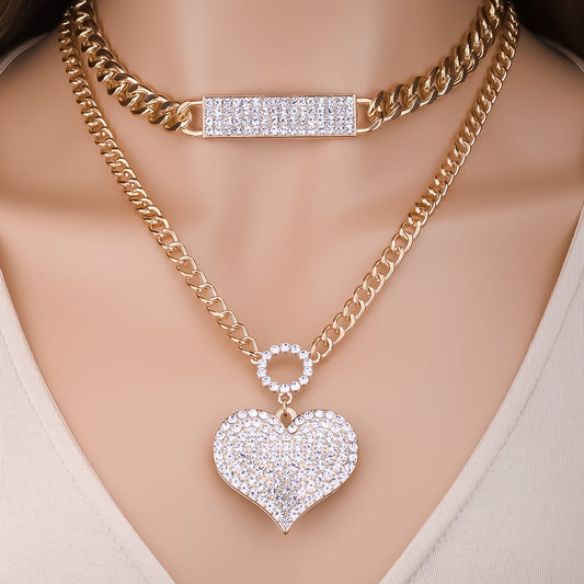 Gold double-chain necklace set with crystal bar and stacked heart pendants