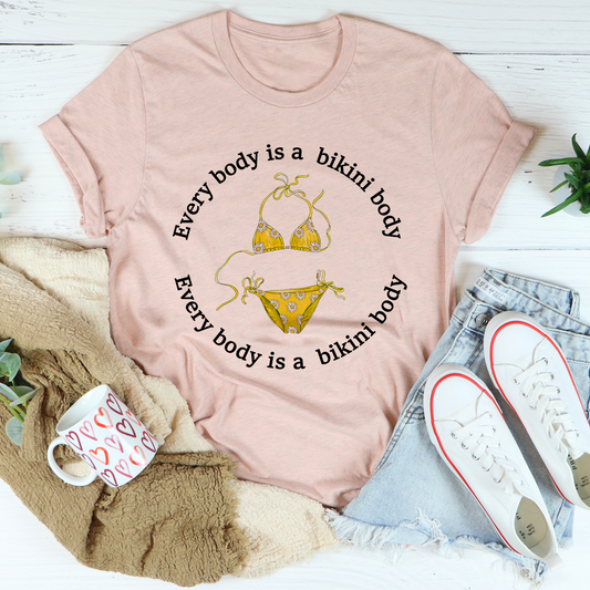 Peach heather T-shirt with bikini graphic and bikini slogan print on front