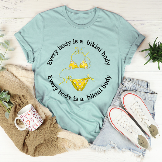 Dusty blue T-shirt with bikini graphic and bikini slogan print on front