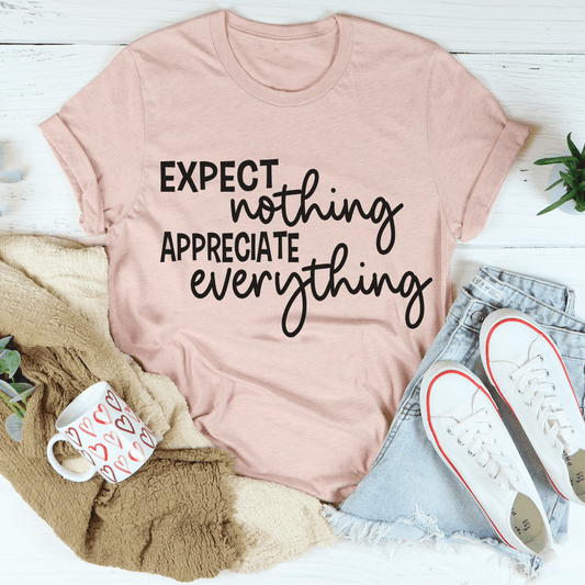 Pink mauve T-shirt with black 'EXPECT nothing APPRECIATE everything' lettering