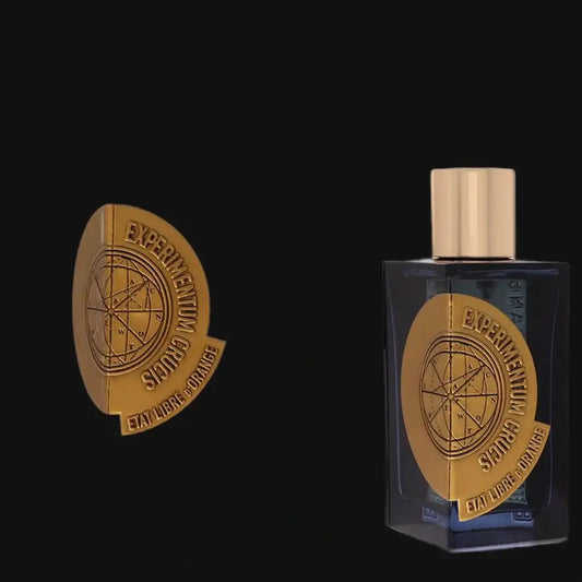 Unisex Eau de Parfum bottle with gold cap, dark glass, Etat Libre d'Orange