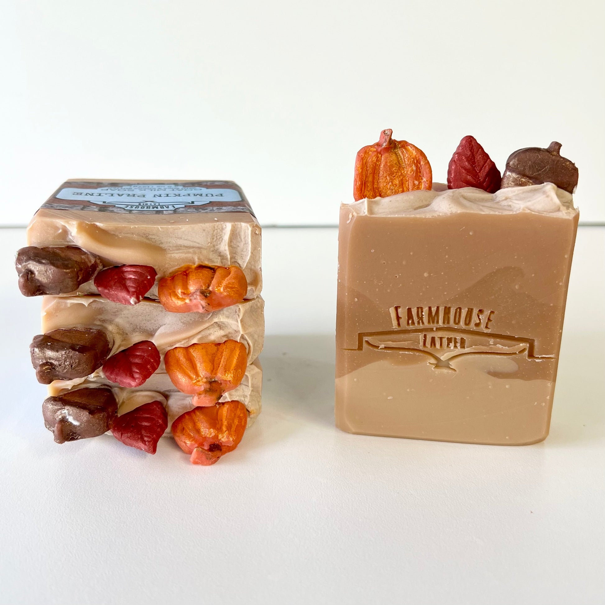 Set of beige goat milk soap bars with embedded pumpkin and chocolate shapes