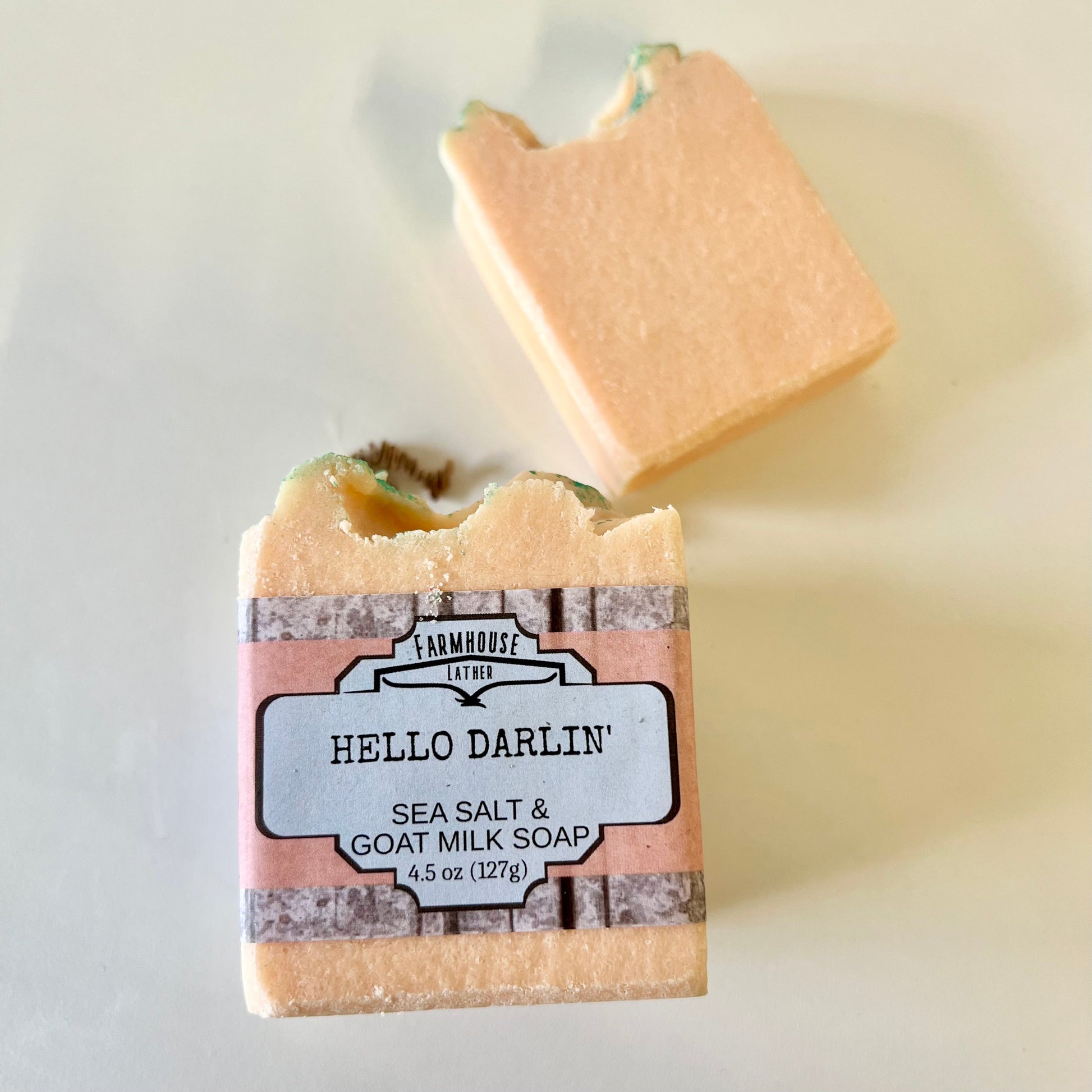 Sea salt and goat milk soap bar with front label, light tan color
