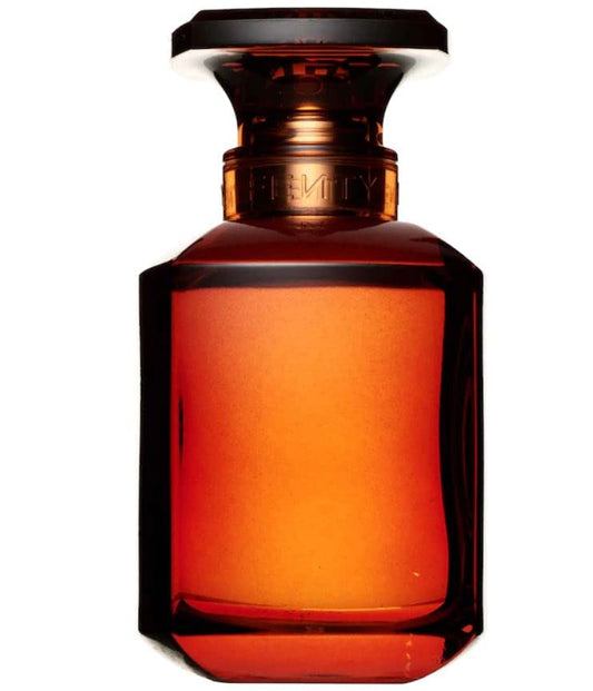 Glass eau de parfum bottle in amber with dark cap; round body and base