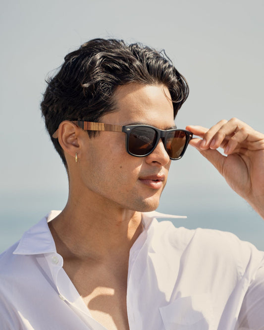 FORREST polarized sunglasses on model, dark frames and amber lenses