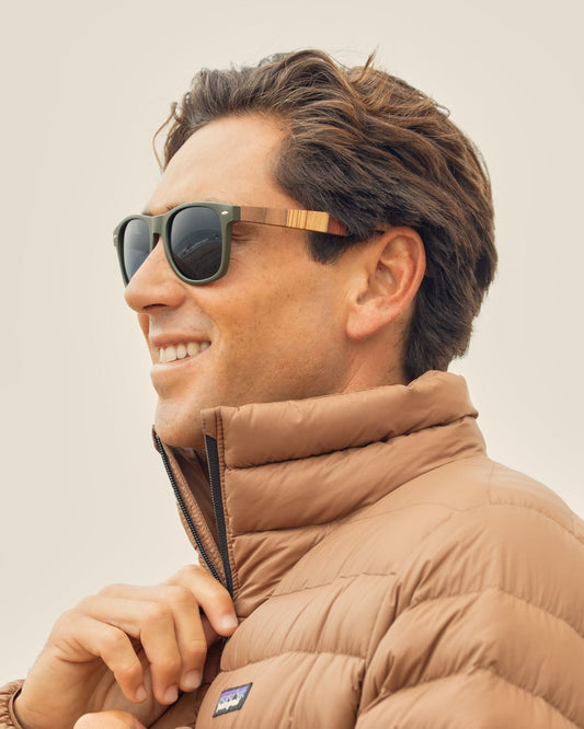 Square polarized sunglasses worn by a man in profile, dark lenses