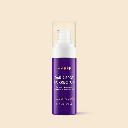 Dark spot corrector serum bottle with purple label and white pump