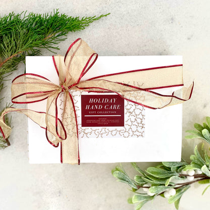 Hand care gift box with ribbon, label reading Holiday Hand Care Gift Collection
