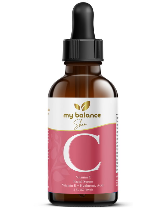 Vitamin C facial serum bottle with black dropper, amber glass and pink label front