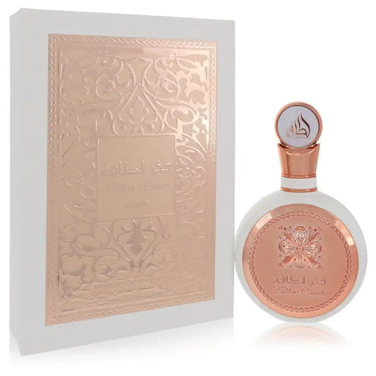 Women’s perfume bottle with rose-gold cap and embossed beige presentation box