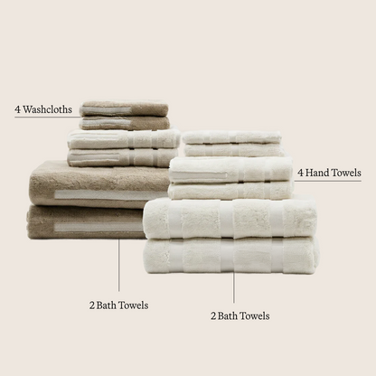 Set of ecru cotton towels: washcloths, hand towels, and bath towels stacked