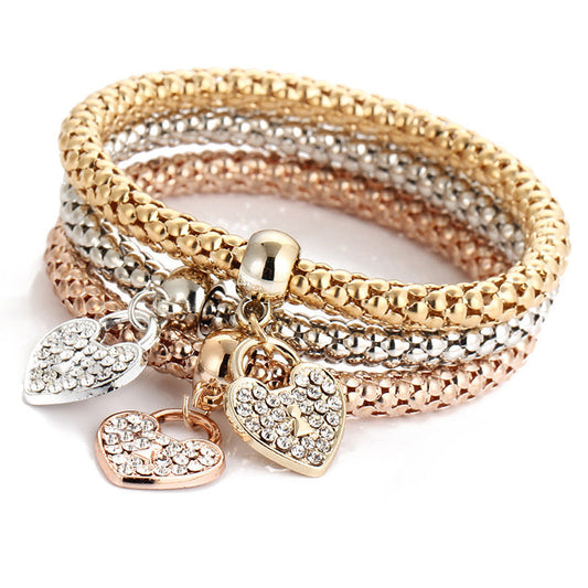 Multicolor rhinestone heart charm bracelet with three woven bangle rows and heart pendants