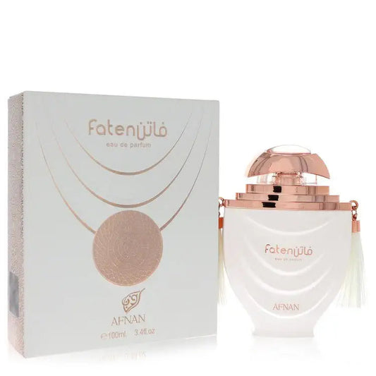 Faten White eau de parfum bottle with matching box, white and rose-gold design.