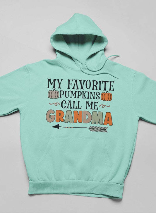 Mint pullover hoodie with hood and front text graphic plus pumpkin illustrations.