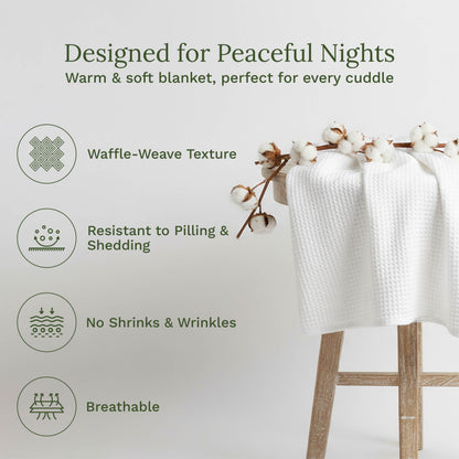 Waffle weave blanket, stacked white waffle-weave fabric on a wooden stand