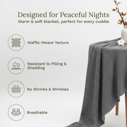 Gray waffle-weave blanket draped over a small wooden stand