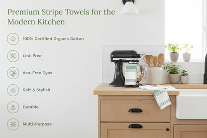 Striped kitchen towels on a kitchen counter, white with green stripes