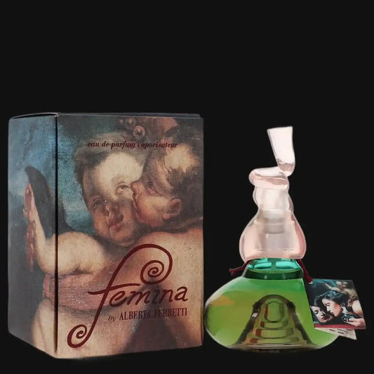 Women’s perfume bottle with green base, clear neck, and white cap; matching box.