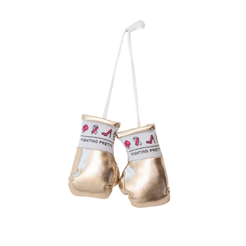 Pair of mini boxing gloves, metallic gold with Fighting Pretty logo on wrist.
