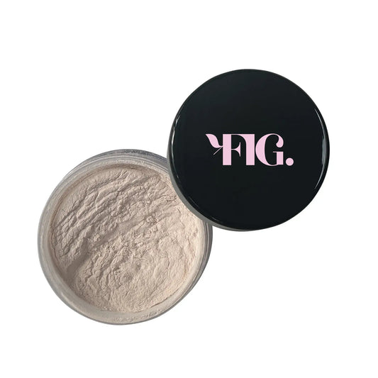 Finishing powder compact with light beige powder pan and black lid
