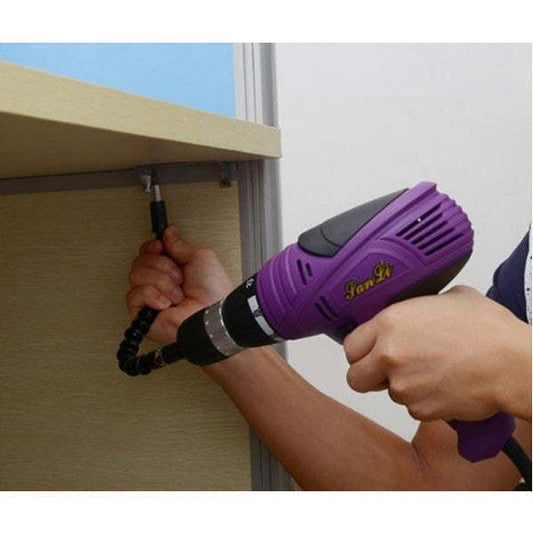 Purple drill adapter with black flexible connector, drill pointed at wood surface