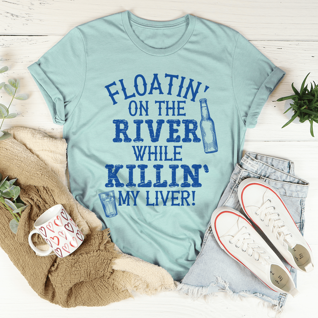 Teal crew-neck t-shirt with blue "Floatin' on the river" slogan graphic