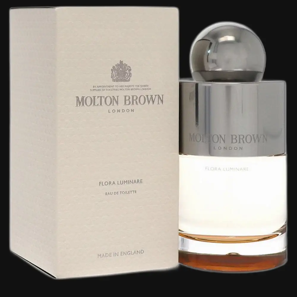 Eau de toilette bottle with chrome cap and matching cream box by Molton Brown.