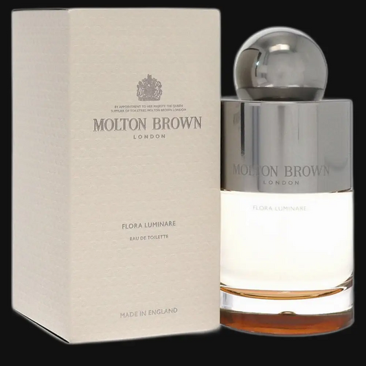 Eau de toilette bottle with chrome cap and matching cream box by Molton Brown.