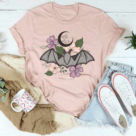 Rose heather floral bat T-shirt with purple and green flower graphic, crew neck.