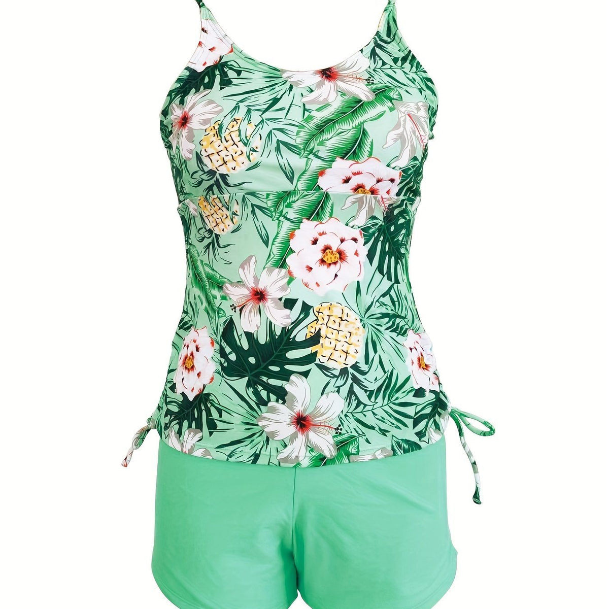 Floral plant print tankini top with tie straps and light green swim shorts