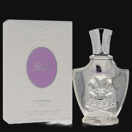 Perfume bottle with silver cap and crest; light box with purple oval label.