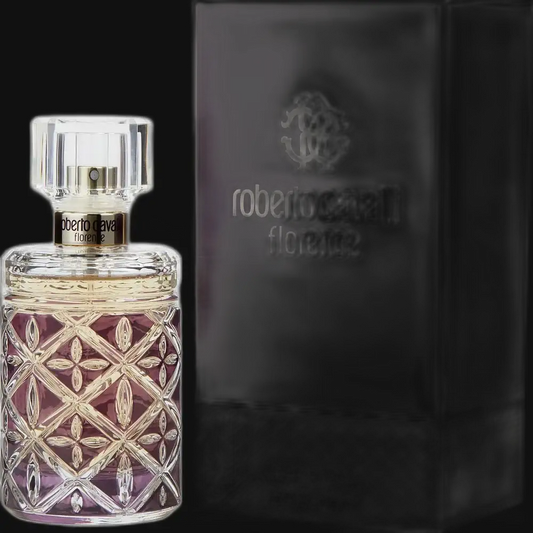 Perfume bottle with clear glass, faceted lid, amber liquid, geometric pink-gold pattern