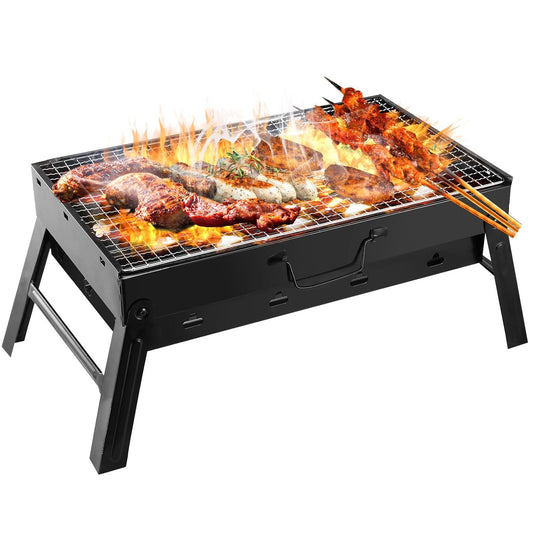 Black portable charcoal grill with cooking grate, flames and meats on top
