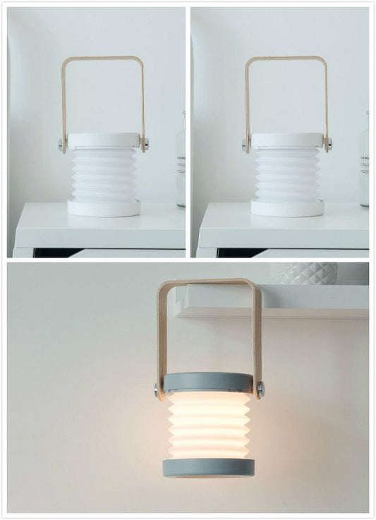 Foldable LED night light lantern with ribbed white body and top carrying handle