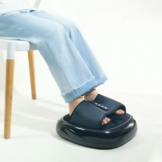 Foot massager in black with control buttons, used with feet inside over jeans