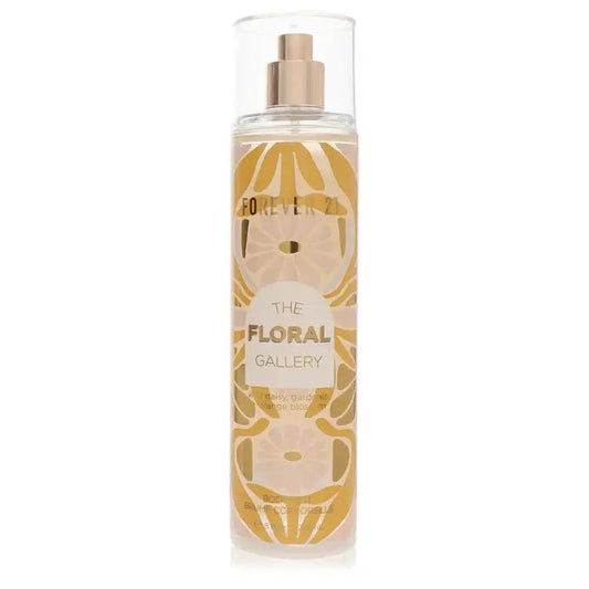 Clear spray perfume bottle with gold cap, amber liquid, and Floral Gallery floral label