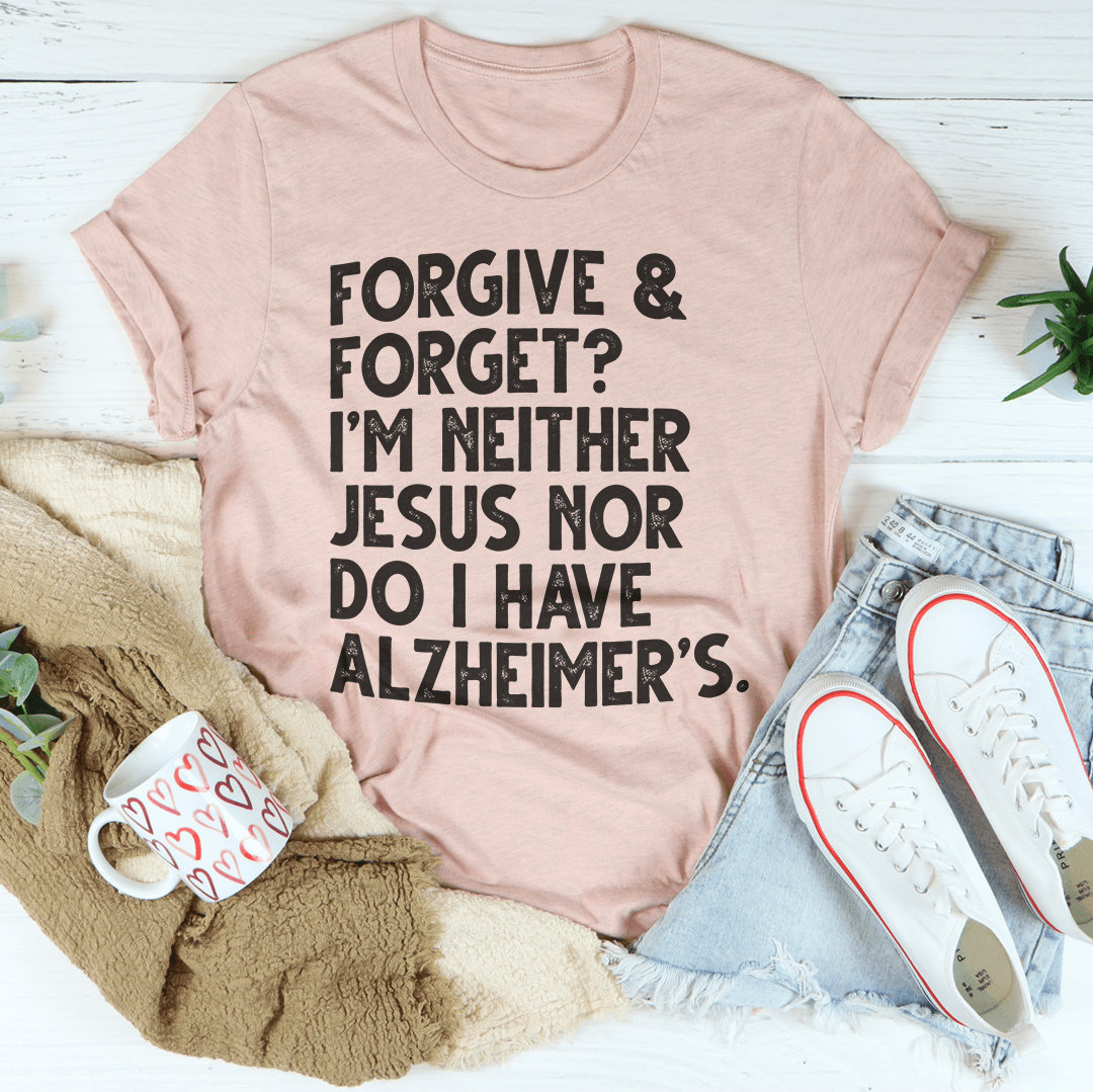Mauve T-shirt flat lay with black "Forgive & Forget?" front text graphic