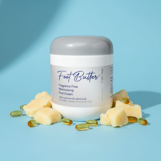 Fragrance-free foot butter cream jar with gray lid and smooth white cream.
