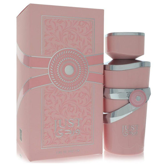 Pink Eau de parfum spray bottle with silver cap and ring, in decorative box.