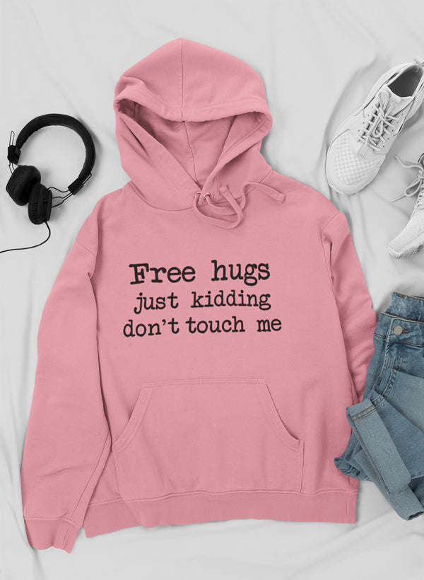 Pink hoodie with front pocket and hood; “Free hugs just kidding don’t touch me” text